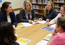 People attending a health literacy resources workshop at a public library in New York City