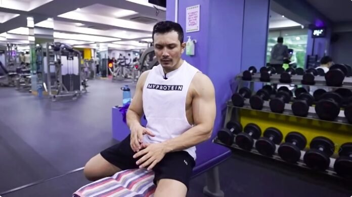 Fix Elbow Pain: The Eccentric Wrist Flexion Rehab Exercise How to treat Elbow Pain From Weight Lifting : a close-up of a person doing a slow, controlled rehab exercise for golfer's elbow.