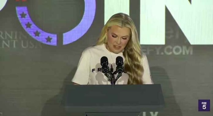 Erika Kirk addresses a TPUSA crowd. Her leadership style emphasizes faith and 